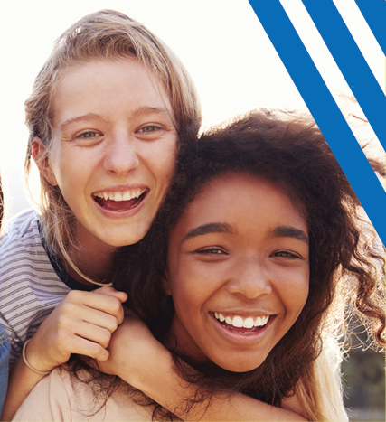 diverse girls hugging and smiling 