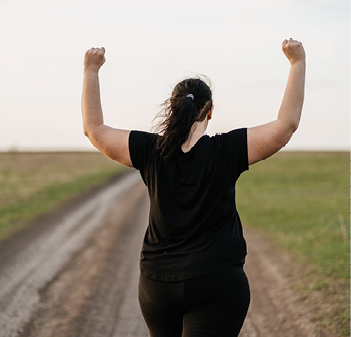 woman raising arm with victory